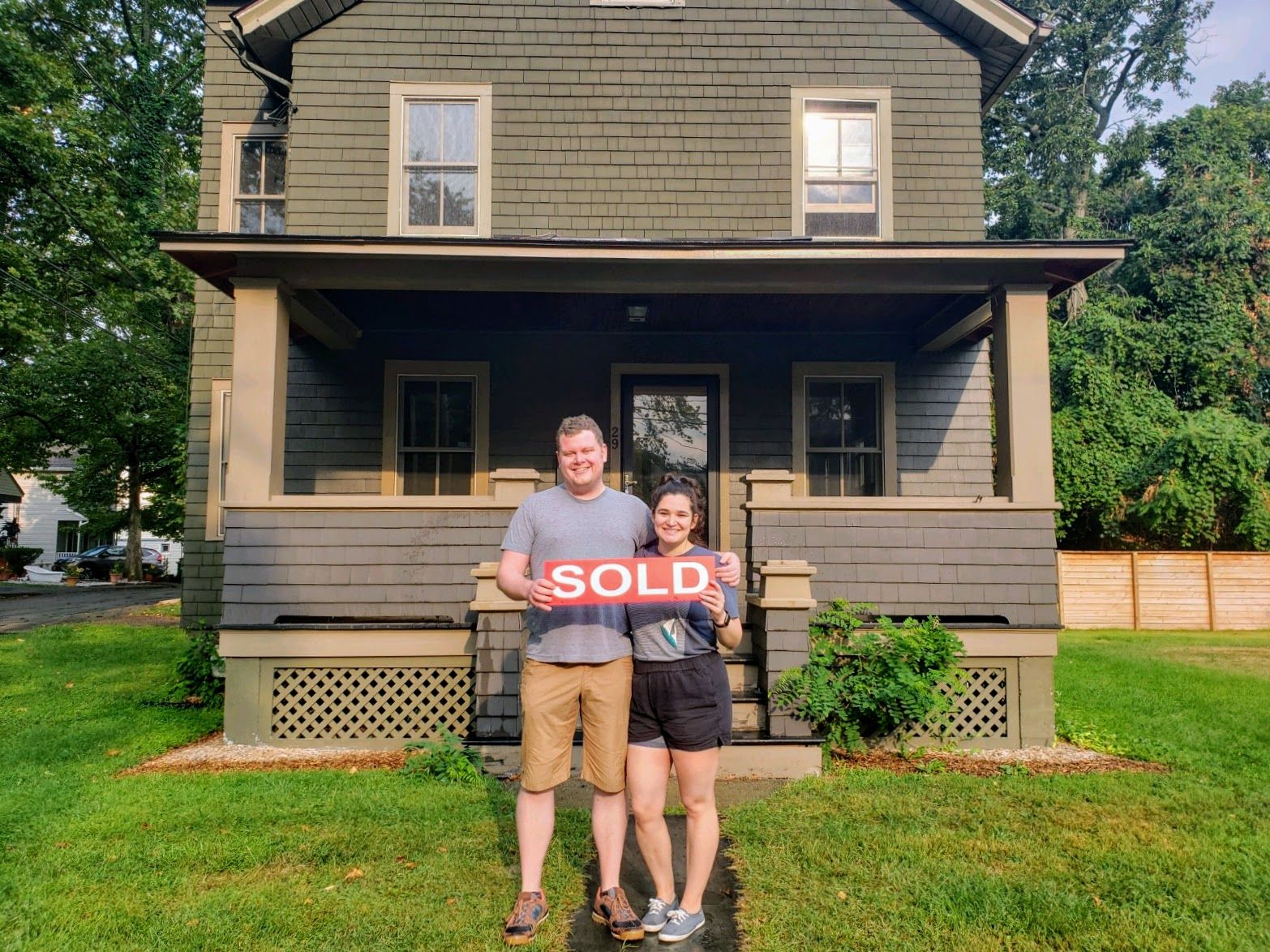 Standing in front of our new house.